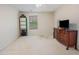Neutral bedroom with standard furniture, including a dresser and corner shelving unit at 100 Full Moon Ct, Garner, NC 27529