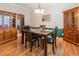 Elegant dining room with hardwood floors, classic furnishings, and decorative wall accents at 100 Full Moon Ct, Garner, NC 27529