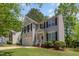 Traditional two-story home with a well-manicured lawn, attached garage, and welcoming front porch at 100 Full Moon Ct, Garner, NC 27529