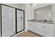 Modern bathroom with double vanity, granite countertops, and glass-enclosed shower at 1009 Rhino Bnd, Oxford, NC 27565