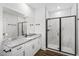 Modern bathroom with a glass-enclosed shower, granite countertop vanity, and a sleek, minimalist design at 1009 Rhino Bnd, Oxford, NC 27565