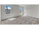 Carpeted bedroom with neutral walls and two windows allowing natural light at 1009 Rhino Bnd, Oxford, NC 27565
