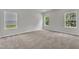 Bright bedroom with plush carpet, neutral walls, and ample natural light at 1009 Rhino Bnd, Oxford, NC 27565