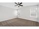 Cozy bedroom features carpeted floors, light-filled windows, a ceiling fan, and freshly painted neutral walls at 1009 Rhino Bnd, Oxford, NC 27565