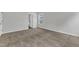 Cozy bedroom featuring plush carpet, neutral walls, and a view of the outdoors at 1009 Rhino Bnd, Oxford, NC 27565