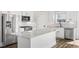 Modern kitchen with stainless steel appliances, a large island, and granite countertops, perfect for cooking at 1009 Rhino Bnd, Oxford, NC 27565