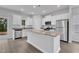 Modern kitchen featuring granite countertops, an island, stainless steel appliances, and white cabinets at 1009 Rhino Bnd, Oxford, NC 27565