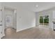Bright living room with wood floors, white walls, and sliding doors to the backyard at 1009 Rhino Bnd, Oxford, NC 27565
