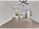 Open-concept living space featuring wood floors, stainless steel appliances, and lots of natural light at 1009 Rhino Bnd, Oxford, NC 27565