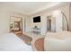 Spacious bedroom with a relaxing seating area and an en-suite bathroom at 1009 Travern Dr, Raleigh, NC 27603