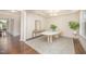 Bright dining room features tray ceiling, modern chandelier, and a unique table creating an elegant space at 1009 Travern Dr, Raleigh, NC 27603