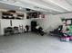 Spacious garage with epoxy flooring and ample overhead storage at 1009 Travern Dr, Raleigh, NC 27603