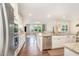 Modern open-concept kitchen featuring stainless steel appliances, granite countertops and hardwood floors at 1009 Travern Dr, Raleigh, NC 27603