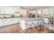 A kitchen featuring a large island with barstool seating, granite countertops and pendant lighting at 1009 Travern Dr, Raleigh, NC 27603