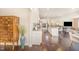 Bright kitchen with granite countertops, white cabinets, stainless steel appliances, and hardwood flooring at 1009 Travern Dr, Raleigh, NC 27603
