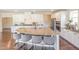 Spacious kitchen with stainless steel appliances and an island with bar seating and pendant lights at 1009 Travern Dr, Raleigh, NC 27603