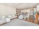 Open-concept living room flowing into the kitchen, featuring a stylish area rug and comfortable seating at 1009 Travern Dr, Raleigh, NC 27603