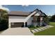 Modern home with attached garage and landscaped front yard at 101 Cochise Cv, Louisburg, NC 27549