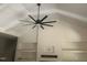 Bright open living room with tall vaulted ceilings and a fireplace with built in shelving at 101 Cochise Cv, Louisburg, NC 27549