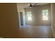 Spacious main bedroom featuring beautiful flooring, two windows, and a ceiling fan at 101 Cochise Cv, Louisburg, NC 27549