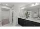 Stylish bathroom featuring a double vanity and an en-suite toilet room at 1011 Canary Pepper Dr, Durham, NC 27713