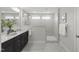 Modern bathroom with double vanity, stylish shower, and elegant finishes at 1011 Canary Pepper Dr, Durham, NC 27713