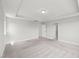 This carpeted room features neutral walls and baseboards for the future homeowner to bring their design ideas at 1011 Canary Pepper Dr, Durham, NC 27713