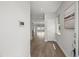 Welcoming entryway with wood floors flows into an open-concept living space at 1011 Canary Pepper Dr, Durham, NC 27713