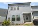Back exterior of home shows a neat lawn and outdoor gas meter at 1011 Canary Pepper Dr, Durham, NC 27713