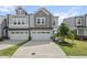 Charming townhome with a two-car garage and well-manicured front yard at 1011 Canary Pepper Dr, Durham, NC 27713