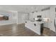 Open kitchen featuring a large island, stainless steel appliances, and a view into the living room at 1011 Canary Pepper Dr, Durham, NC 27713