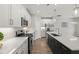 Well-lit kitchen boasts stainless appliances, a central island with a sink, and white cabinets at 1011 Canary Pepper Dr, Durham, NC 27713