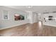Bright and spacious living room featuring wood floors and a mounted flat screen television at 1011 Canary Pepper Dr, Durham, NC 27713