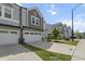 Street view of townhouses highlighting well-maintained lawns and architectural harmony at 1011 Canary Pepper Dr, Durham, NC 27713