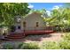 Backyard view with wooden deck and landscaped yard at 1040 Mills St, Raleigh, NC 27608