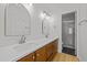 Double vanity bath with two mirrors, and a shower with glass doors at 1040 Mills St, Raleigh, NC 27608