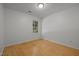 Bedroom featuring hardwood floors and a window at 1040 Mills St, Raleigh, NC 27608
