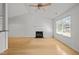 Bright living room boasting hardwood floors, a cozy fireplace, and lots of natural light at 1040 Mills St, Raleigh, NC 27608