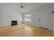 Inviting living room showcasing hardwood floors, a fireplace, and a bright window at 1040 Mills St, Raleigh, NC 27608