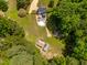 Bird's-eye view of the home's backyard featuring the pool, patio, and surrounding landscape at 105 Kirkland Ct, Archer Lodge, NC 27527