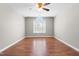 Neutral bedroom with hardwood floors and a window for plenty of natural light at 105 Kirkland Ct, Archer Lodge, NC 27527