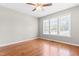 This bedroom features wood floors, ceiling fan and three windows at 105 Kirkland Ct, Archer Lodge, NC 27527