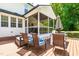 A view of the outdoor deck with seating near a screened-in porch at 105 Kirkland Ct, Archer Lodge, NC 27527