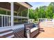 A view of the deck seating near the screened-in porch and pool at 105 Kirkland Ct, Archer Lodge, NC 27527