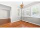 Dining room with beautiful hardwood floors and a decorative hanging light fixture at 105 Kirkland Ct, Archer Lodge, NC 27527