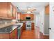 The kitchen features custom cabinets, stainless steel appliances, and hardwood floors at 105 Kirkland Ct, Archer Lodge, NC 27527