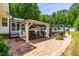 Outdoor patio area with a shaded gazebo, furniture, grilling area and walkway pavers at 105 Kirkland Ct, Archer Lodge, NC 27527