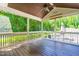 A screened-in porch with seating and views of the wooded backyard at 105 Kirkland Ct, Archer Lodge, NC 27527