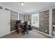 Home office featuring textured walls, a window providing natural light, and a rolling office chair at 109 Winding Creek Dr, Youngsville, NC 27596