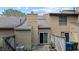 Charming townhouse backyard features a private patio, sliding glass door and mature landscaping at 11 Stone Village, Durham, NC 27704